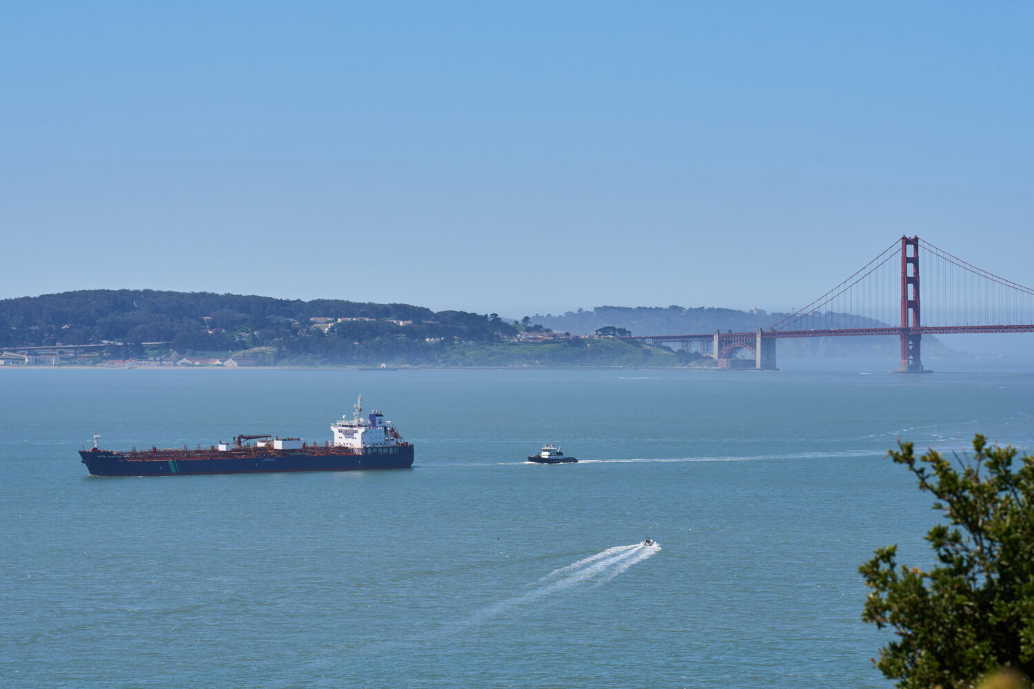A tanker and other vessels pass through the San Francisco Bay, Tuesday, May 19, 2026. (AP Photo/Ann...
