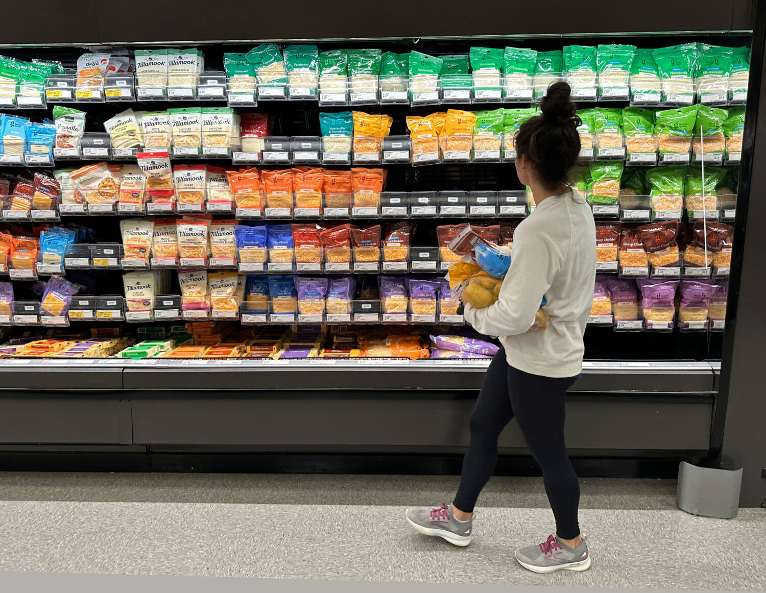 FILE - A shopper peruses cheese offerings at a Target store Wednesday, Oct. 4, 2023, in Sheridan, C...