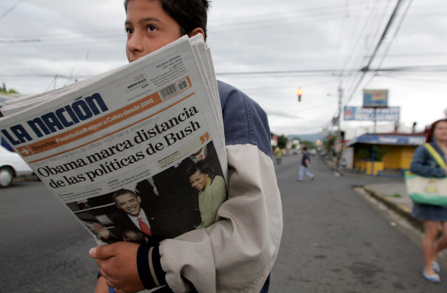 FILE - A vender sells La Nation newspapers in San Jose, Jan. 21, 2009. (AP Photo/Kent Gilbert, File...