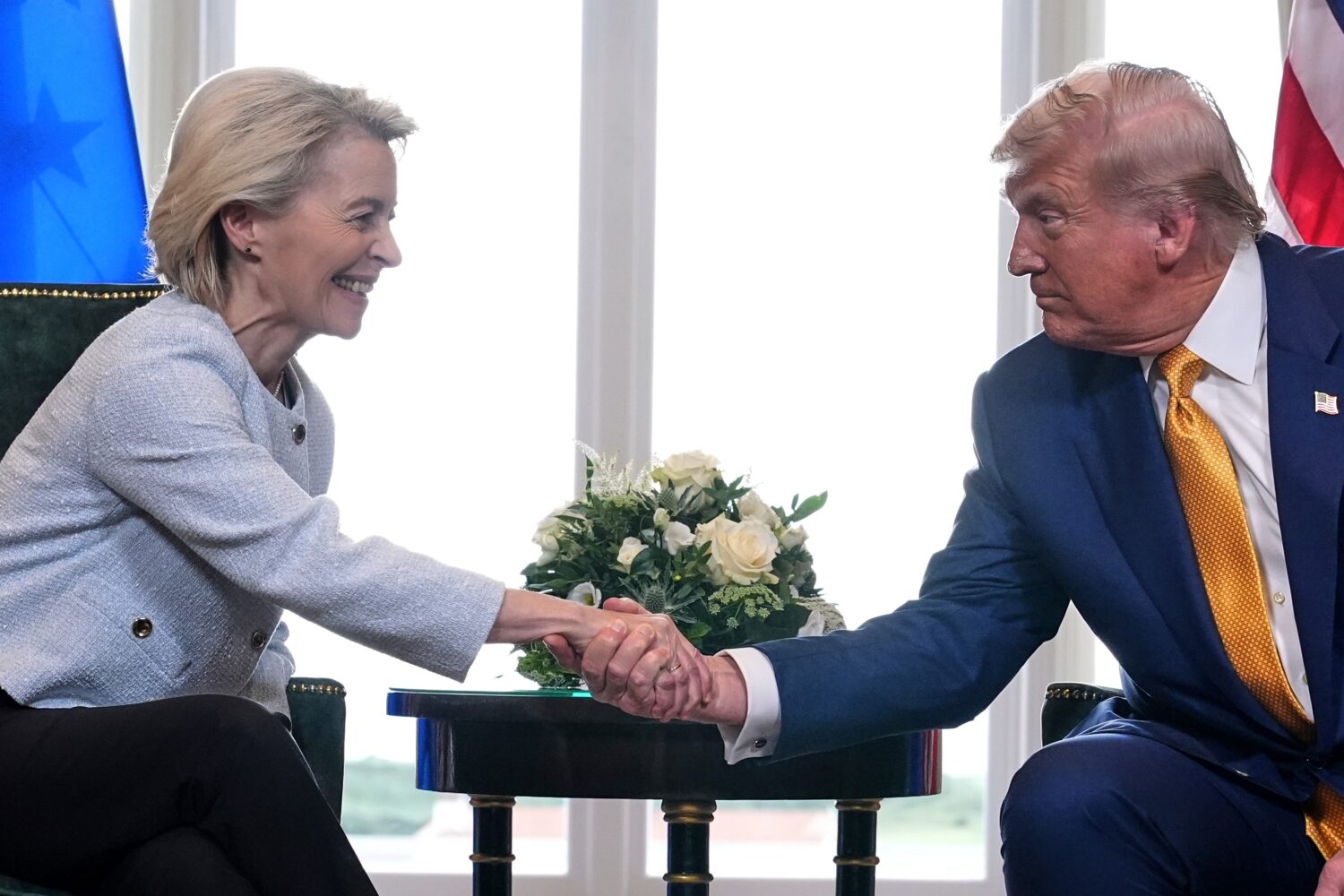 FILE - President Donald Trump and European Commission President Ursula von der Leyen shake hands af...