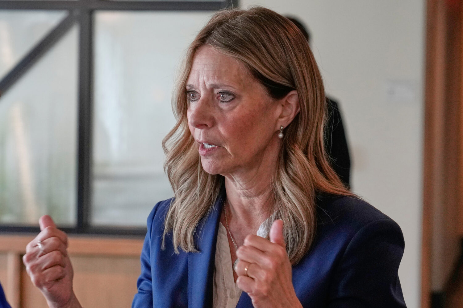 FILE - Amy Acton, Democratic candidate for Governor of Ohio, gestures as she speaks with a reporter...