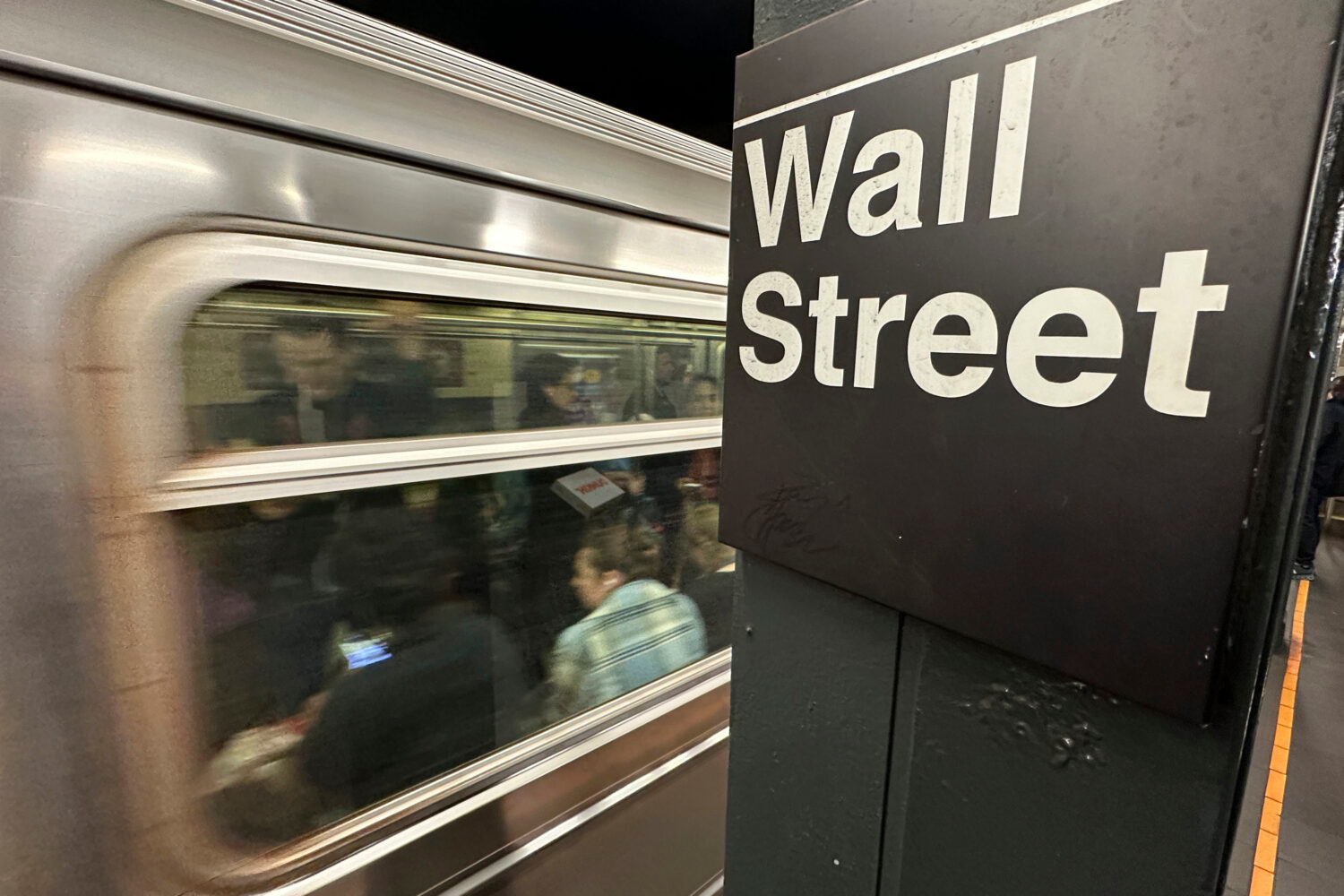 FILE - A train arrives at a Wall Street subway station in New York's Financial District on Nov. 5, ...