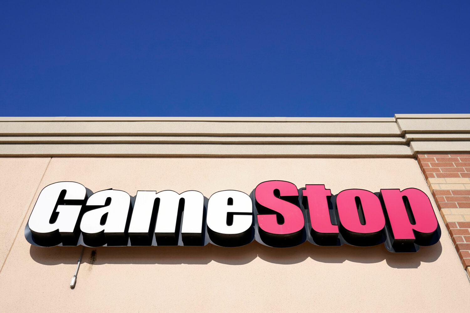 FILE - A GameStop sign is displayed above a store in Urbandale, Iowa, on Jan. 28, 2021. (AP Photo/C...