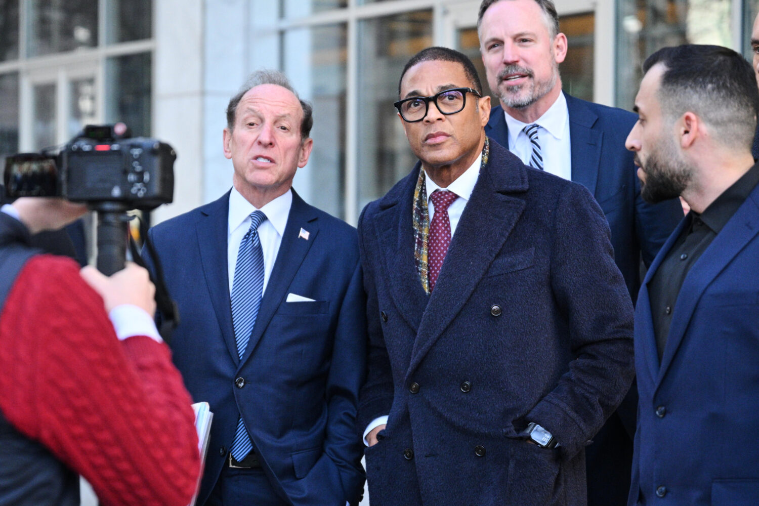 FILE - Journalist Don Lemon, center, exits the U.S. District Courthouse in St. Paul, Minn., Feb. 13...