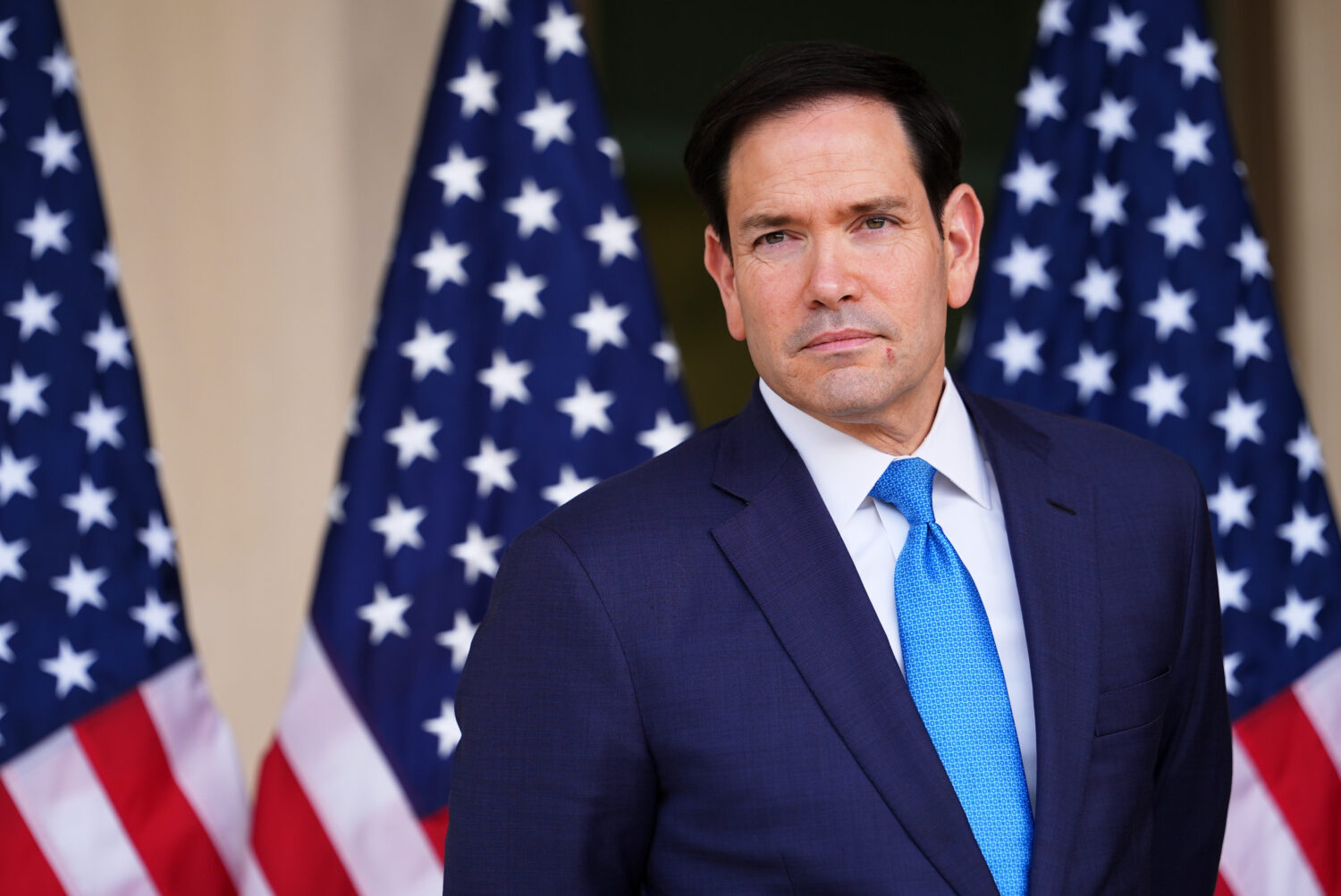 United States Secretary of State Marco Rubio, waits as US Ambassador to India Sergio Gor, unseen, s...