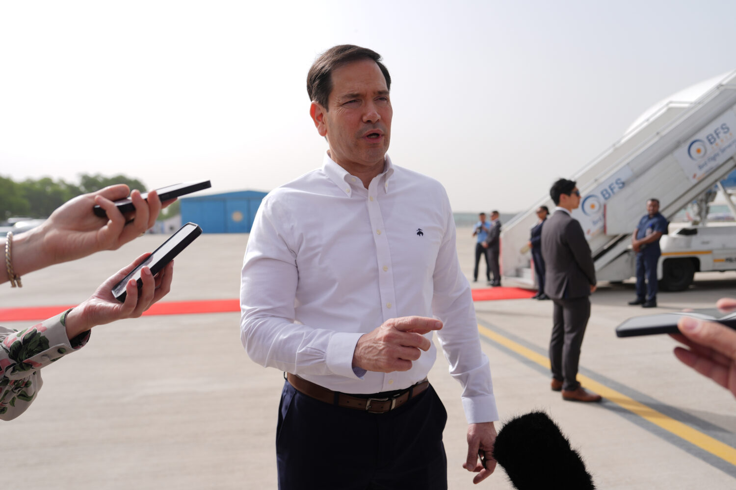 United States Secretary of State Marco Rubio speaks to the journalists before boarding his plane at...