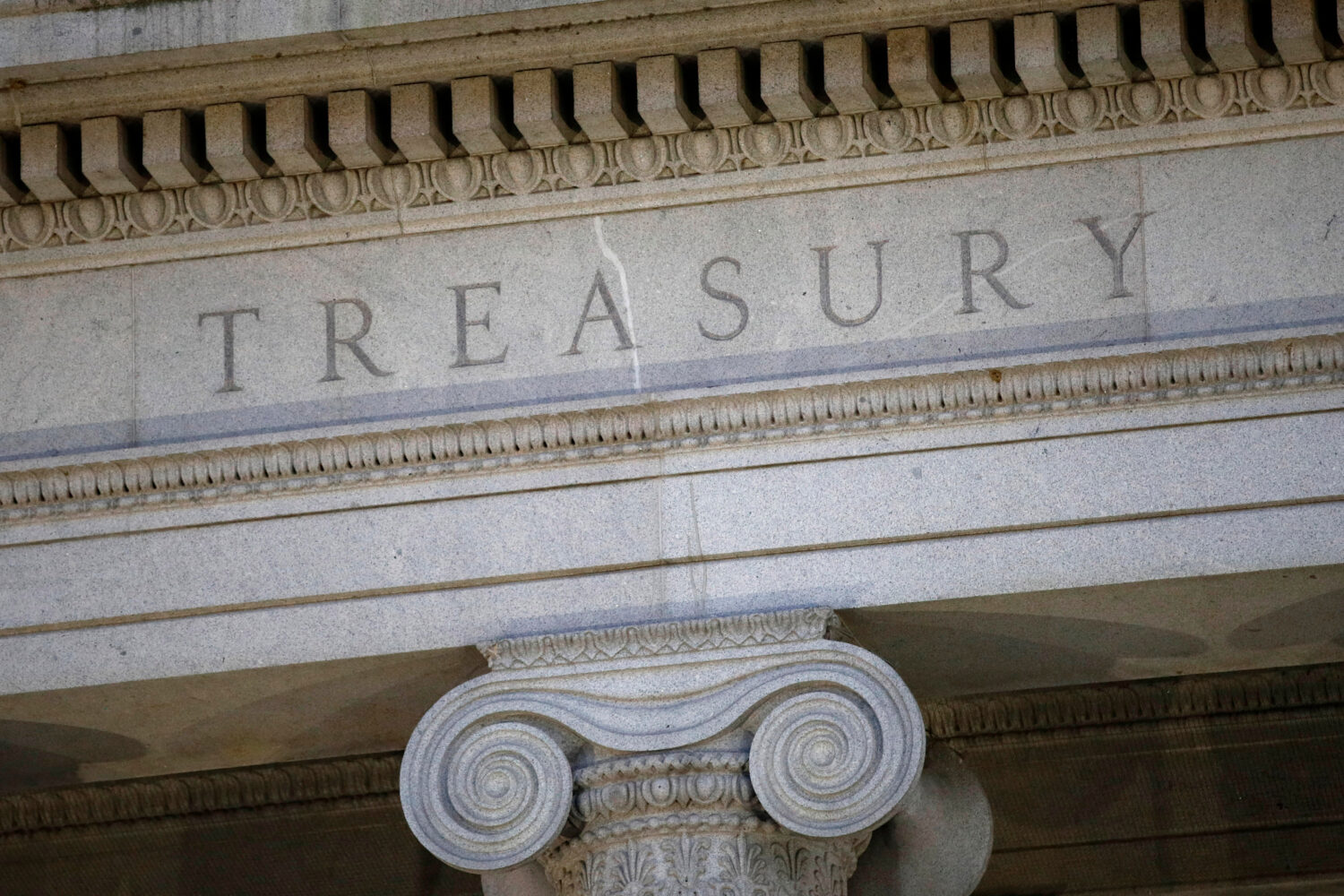 FILE - The Treasury Department building is pictured at dusk in Washington, June 6, 2019. (AP Photo/...