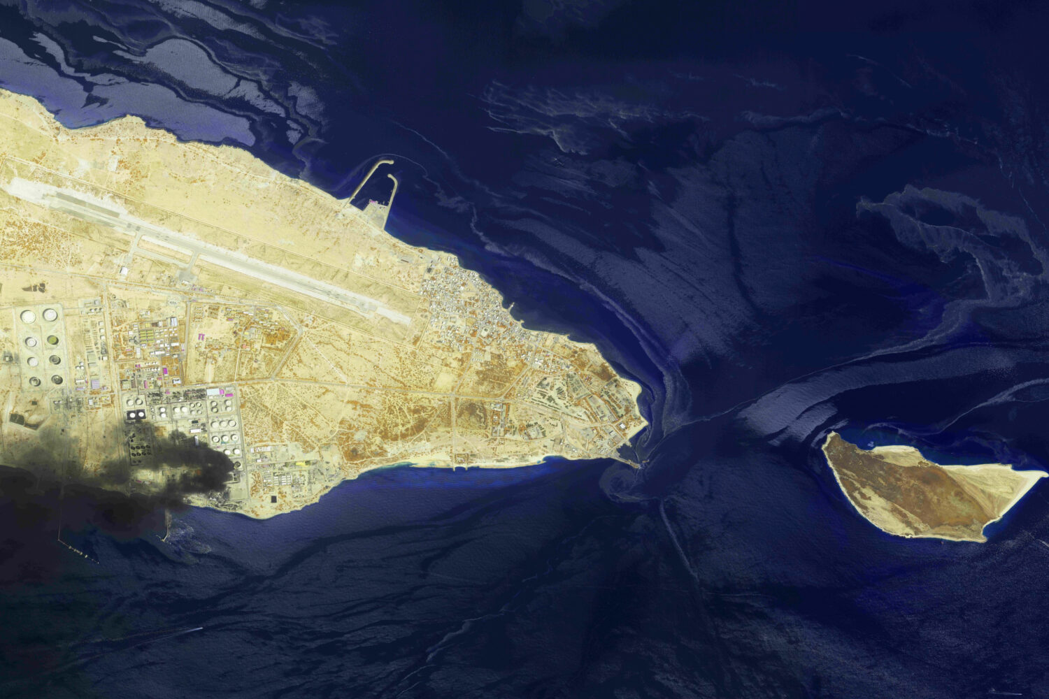 This image from an Airbus Defence and Space's Pléiades Neo satellite shows a fire at an oil refine...
