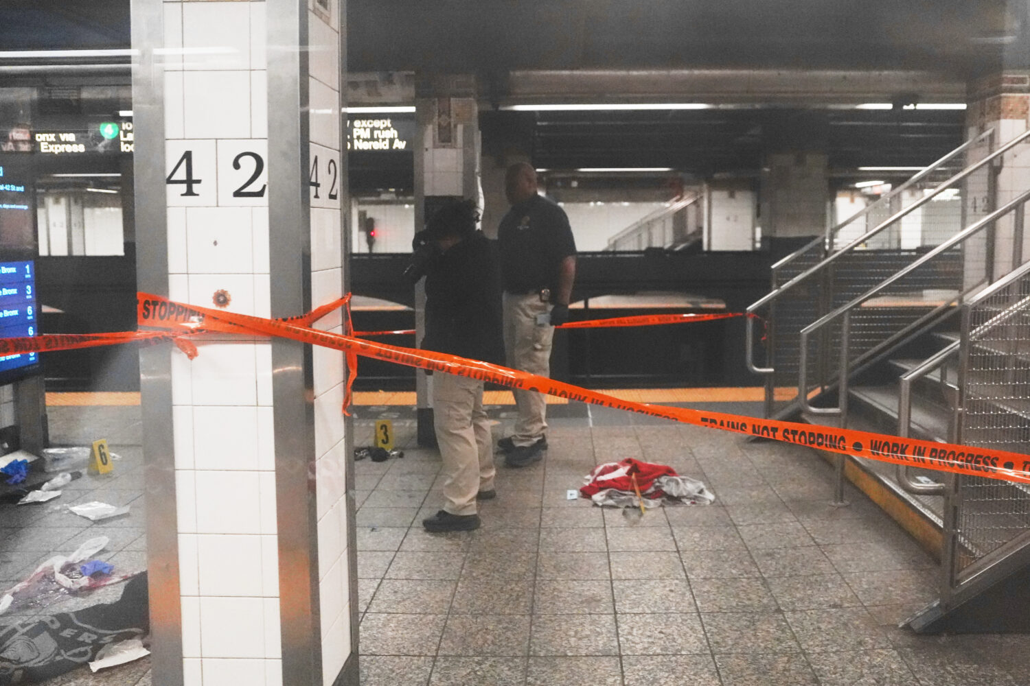 Police investigate the scene after a reported stabbing and shooting at the Grand Central subway sta...
