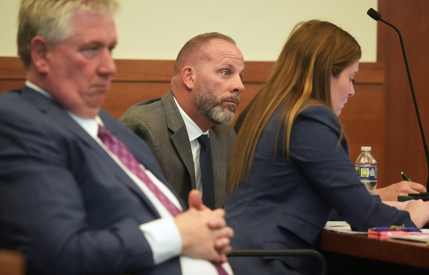 FILE - Jason Meade, center, sits with his attorneys Mark Collins, left, and Kaitlyn Stephens, right...