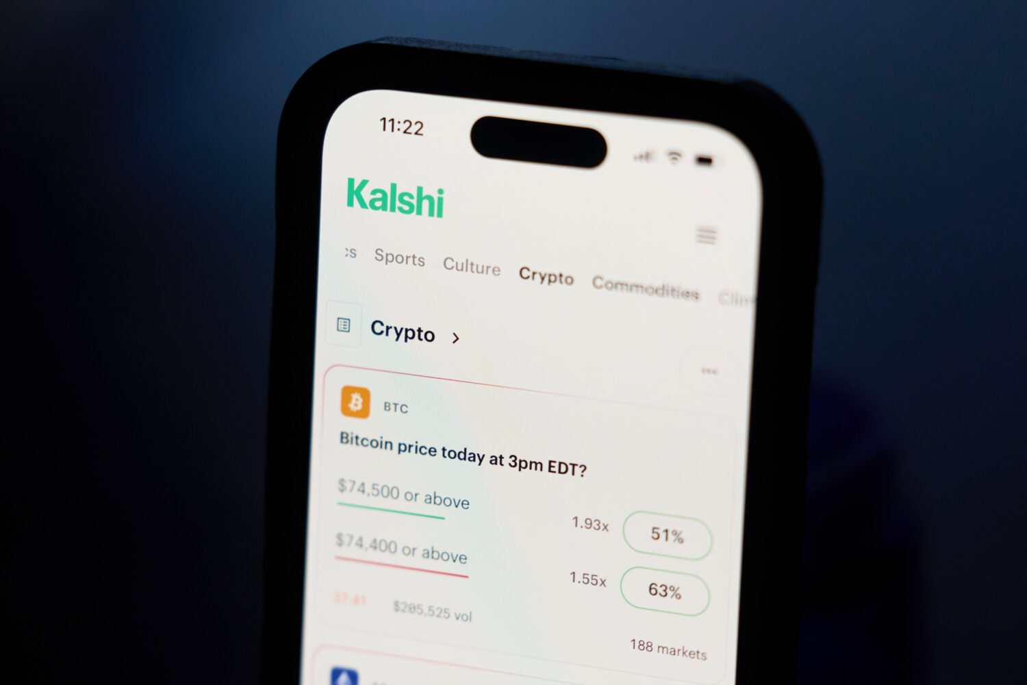 FILE - A phone displays crypto prices on the Kalshi app on April 16, 2026, in Portland, Ore. (AP Ph...