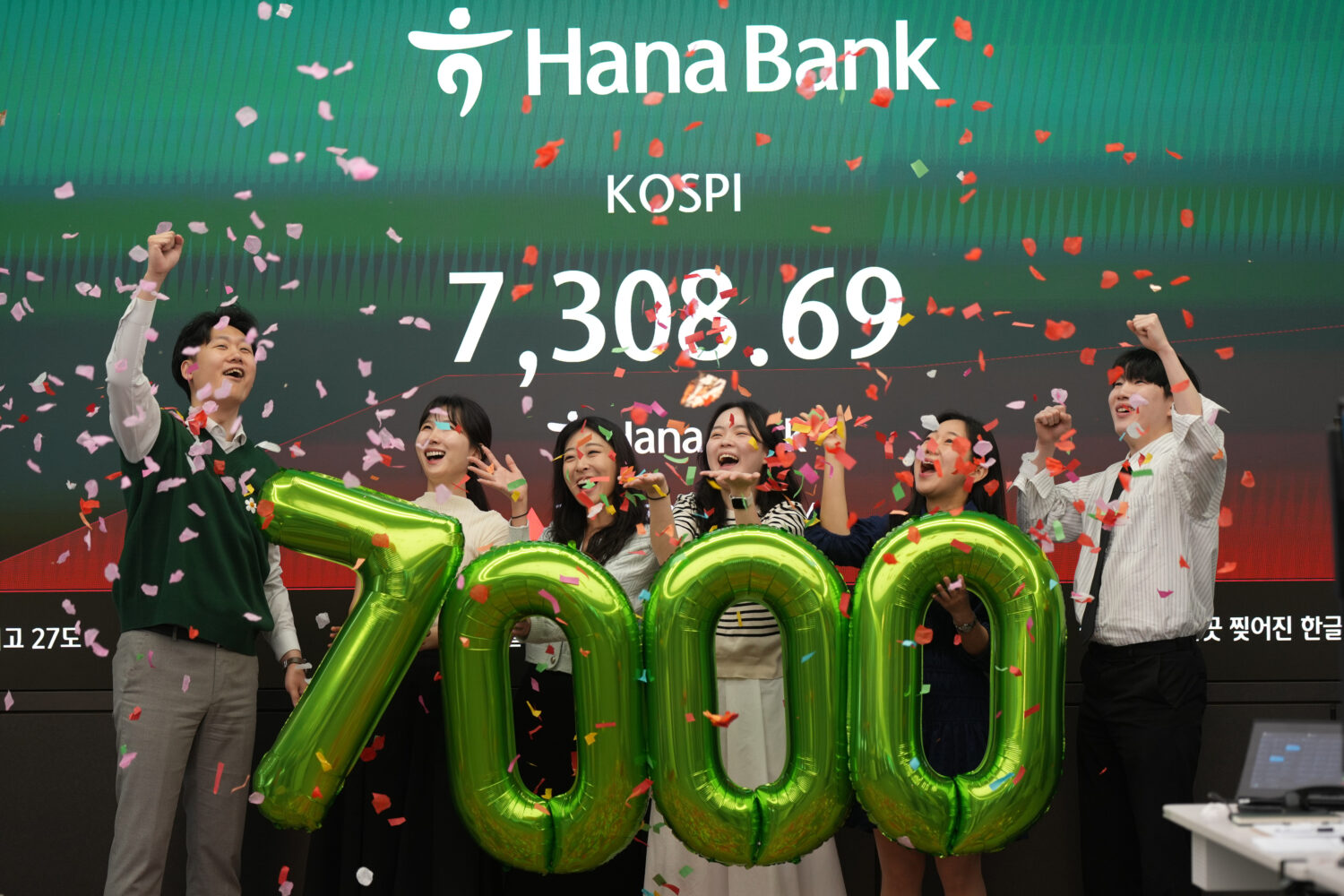 Employees of Hana Bank celebrate in a photo opportunity to mark the Korea Composite Stock Price Ind...