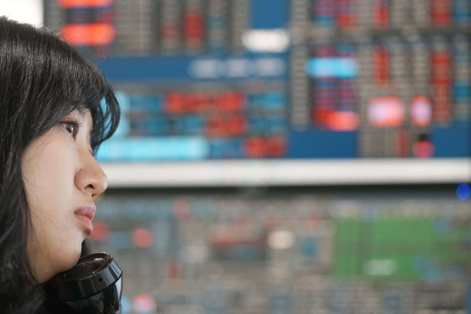 A dealer talks on the phone at a dealing room of Hana Bank in Seoul, South Korea, Wednesday, May 13...