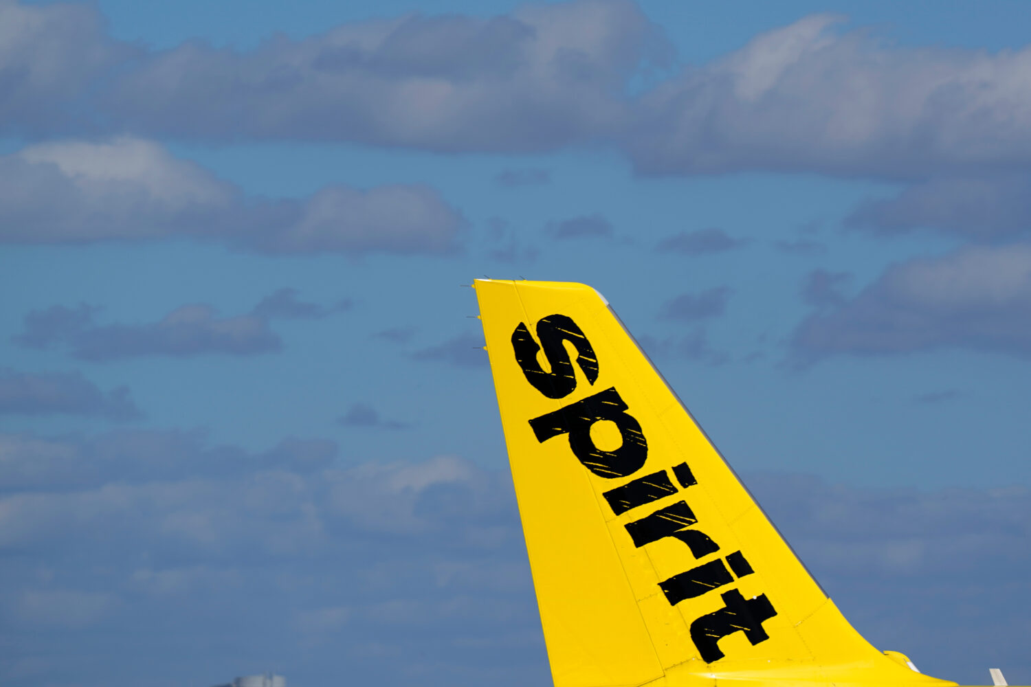 FILE - The tail of a Spirit Airlines Airbus A320 is shown as the plane prepares to take off from Fo...