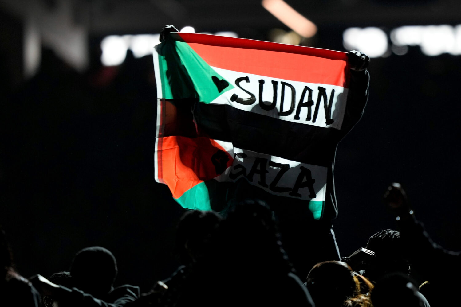 FILE - A flag is raised during halftime of the NFL Super Bowl 59 football game between the Kansas C...