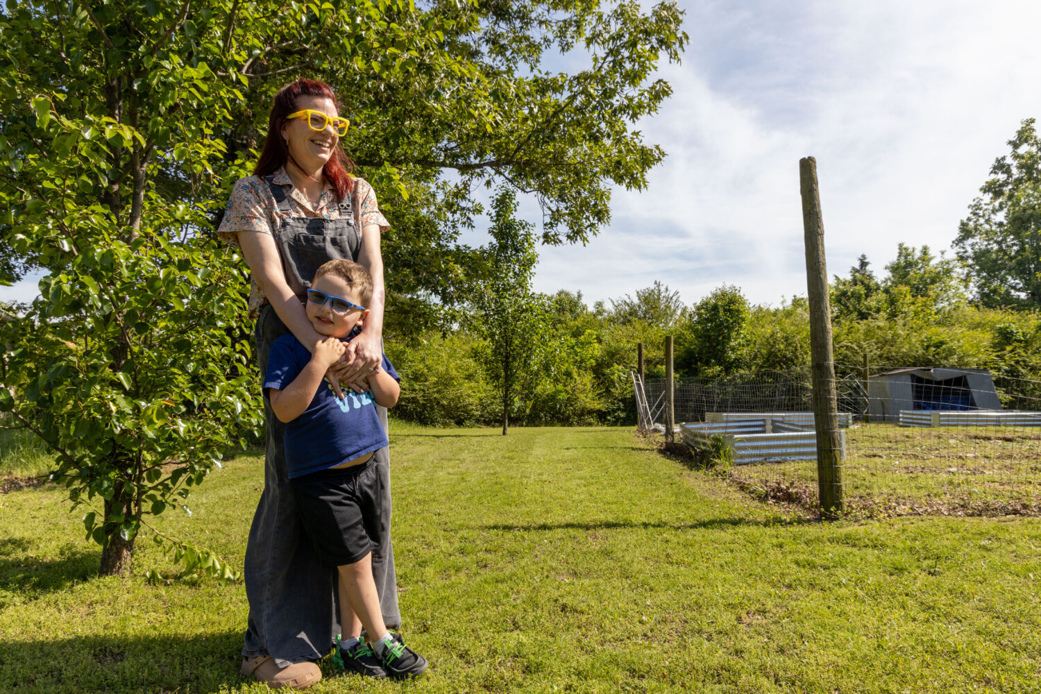 In this photo provided by KOSU, Ashley Caudle, a citizen of the Cherokee Nation, wraps her arms aro...