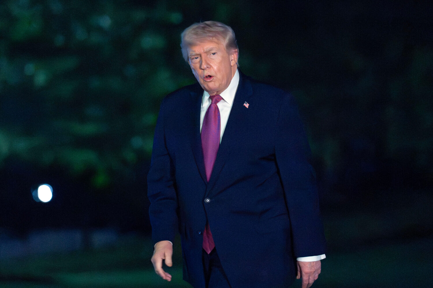 President Donald Trump walks on the South Lawn upon his arrival to the White House, Friday, April 1...