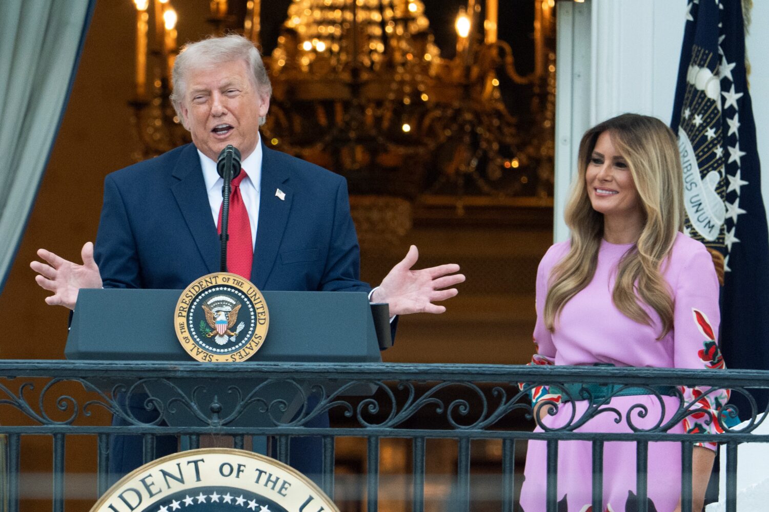 President Donald Trump with first lady Melania Trump addresses the attendees from the Blue Room Bal...