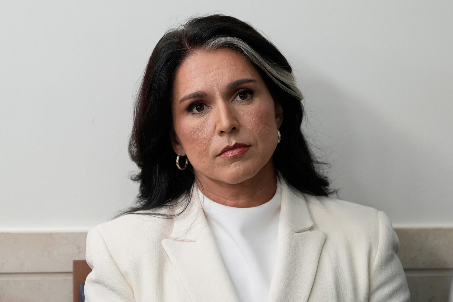 FILE - Director of National Intelligence Tulsi Gabbard sits in the James Brady Press Briefing Room ...