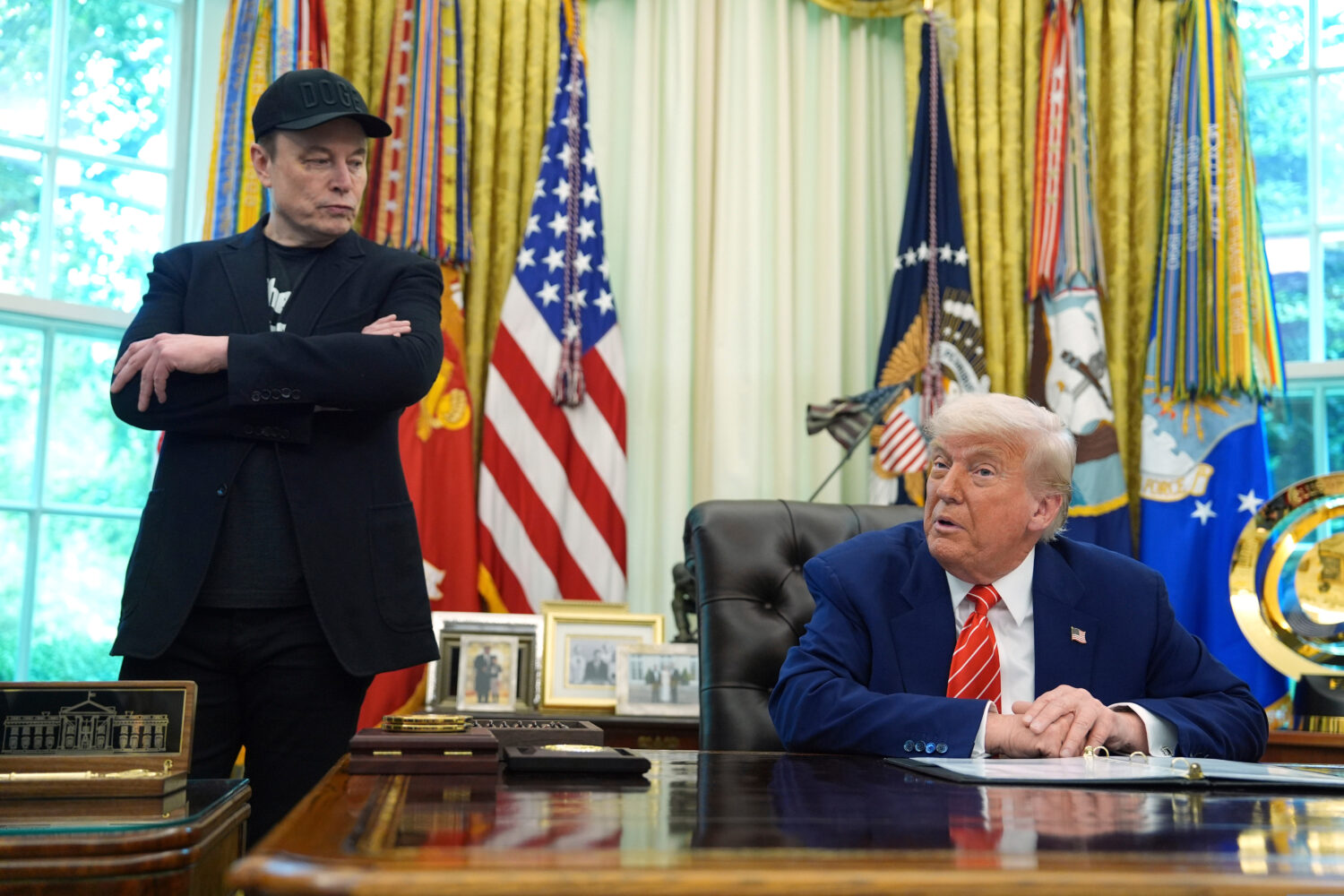 FILE - President Donald Trump, right, speaks during a news conference with Elon Musk in the Oval Of...