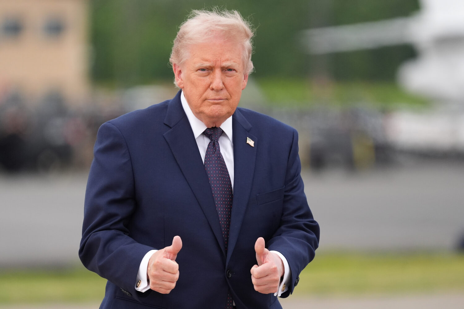 President Donald Trump walks from Marine One to board Air Force One at Morristown Airport, Friday, ...