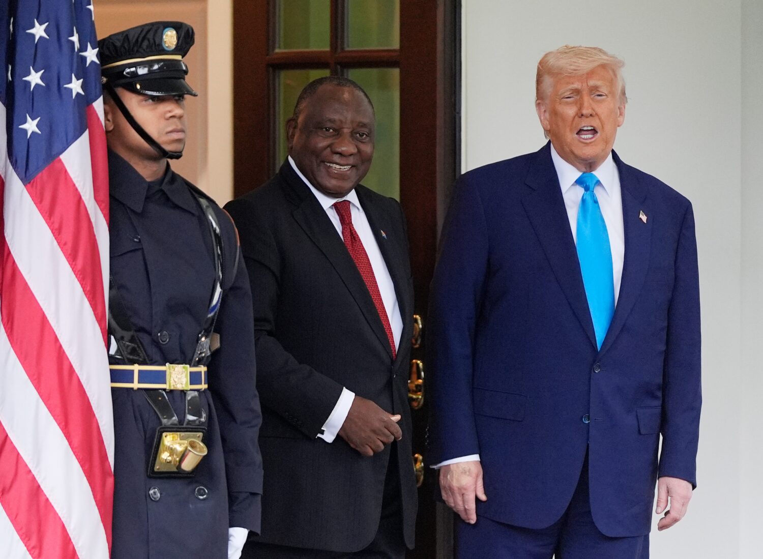 FILE - President Donald Trump greets South African President Cyril Ramaphosa, center, at the White ...