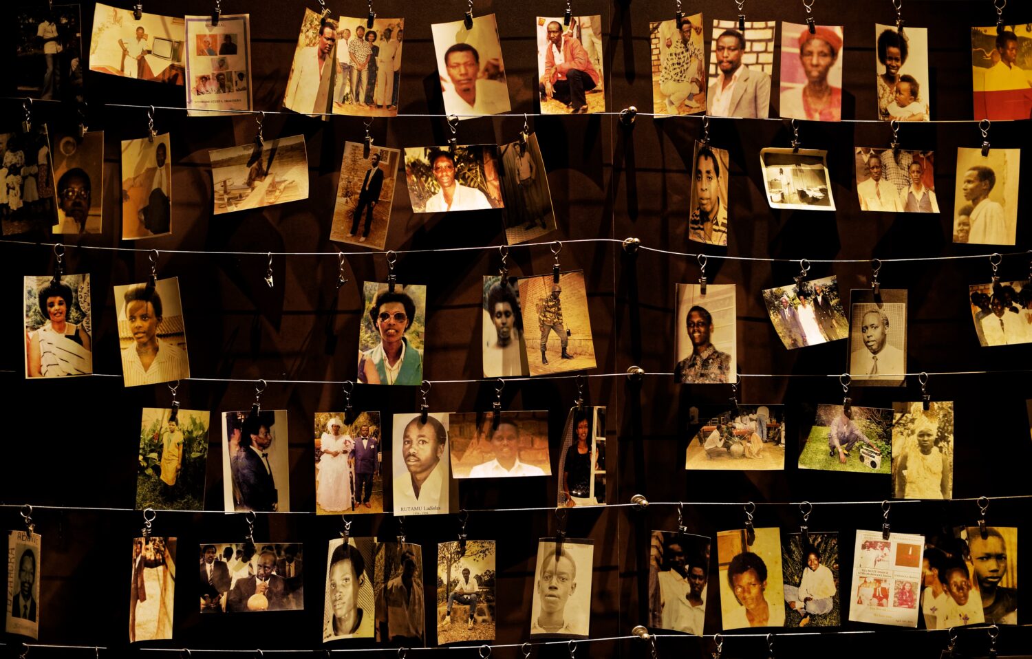 FILE - Family photographs of people killed in the Rwandan genocide are on display at the Kigali Gen...