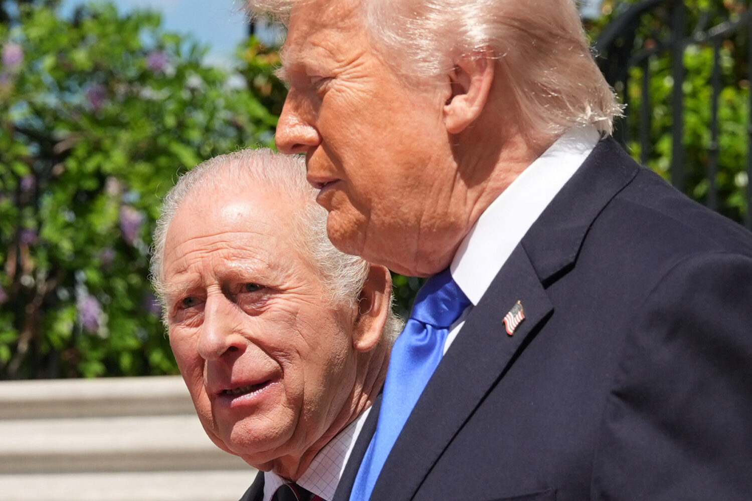 President Donald Trump walks with Britain's King Charles III during the departure on the South Lawn...