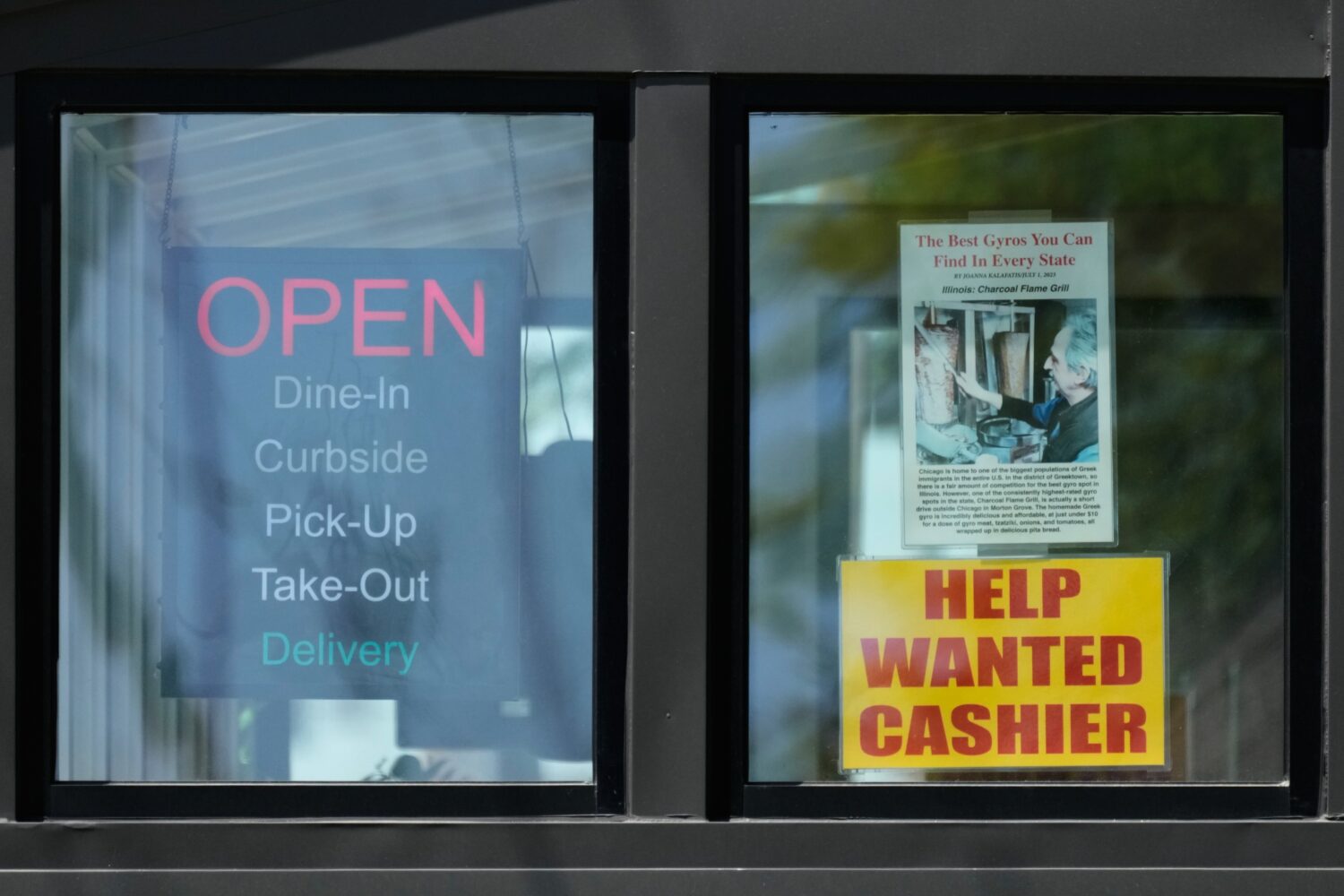 A hiring sign is displayed at a restaurant in Morton Grove, Ill., Thursday, May 14, 2026. (AP Photo...