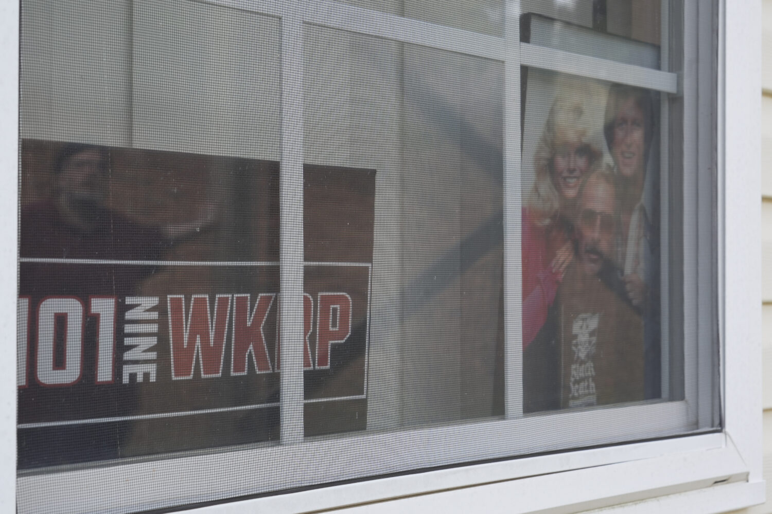 FILE - A photo of the cast members of the sitcom "WKRP in Cincinnati" sits in a window at the home ...