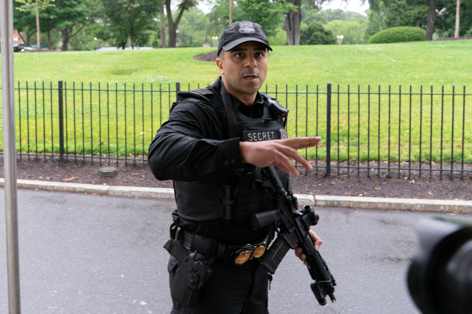A member of the Secret Service stops journalists from leaving the White House, Saturday, May 23, 20...