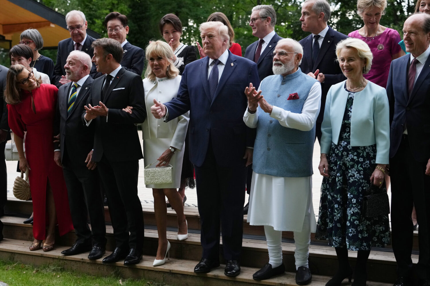 U.S. President Donald Trump and other leaders pose during a group photo of leaders at the G7 summit...