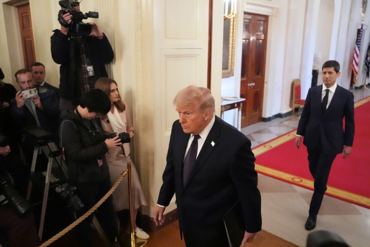 President Donald Trump, left, and Kevin Warsh arrive at a swearing-in ceremony for Warsh as Chairma...