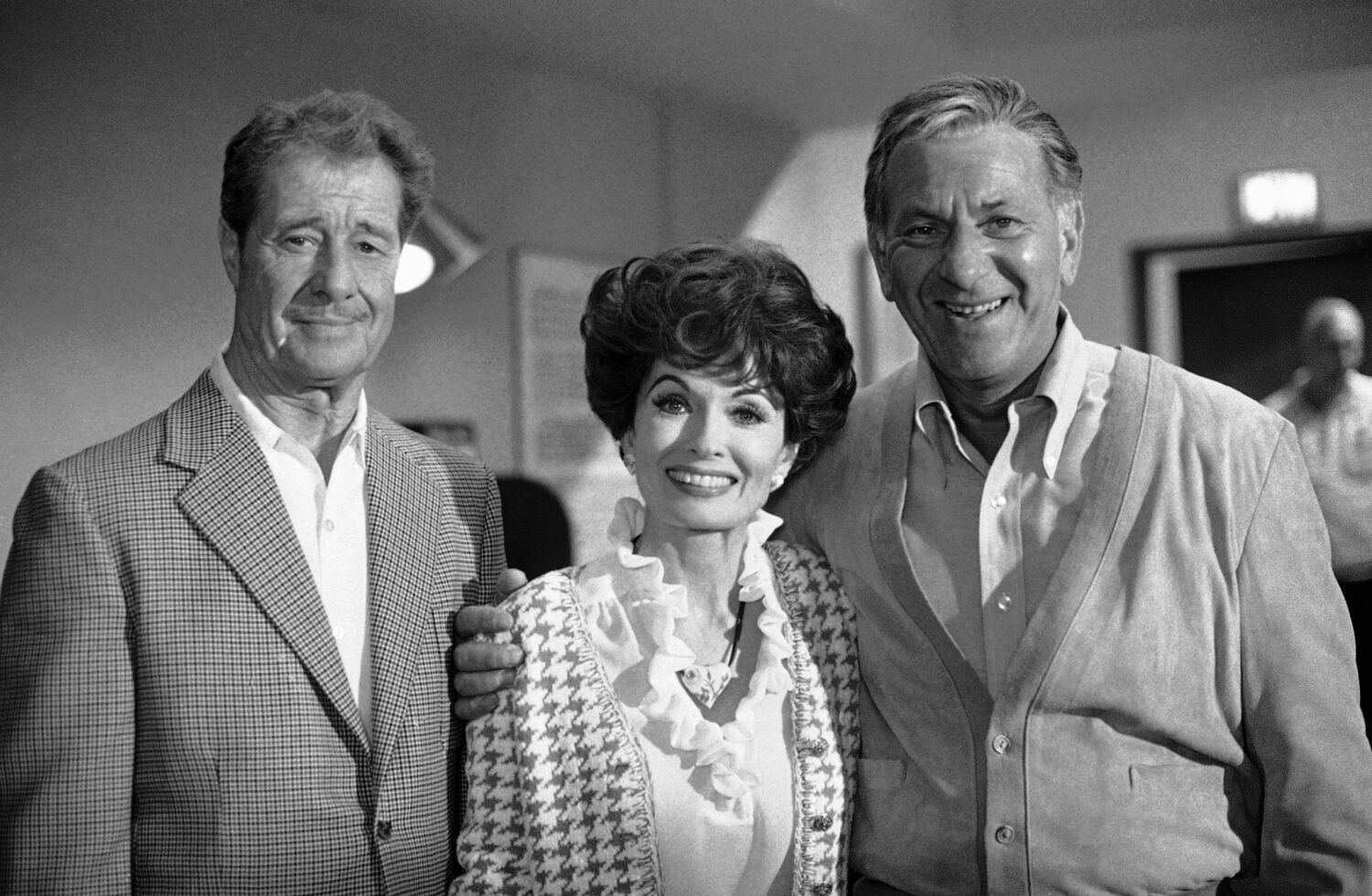 FILE - Don Ameche, left, and Ann Blyth, center, as guest stars, join Jack Klugman on the set for an...