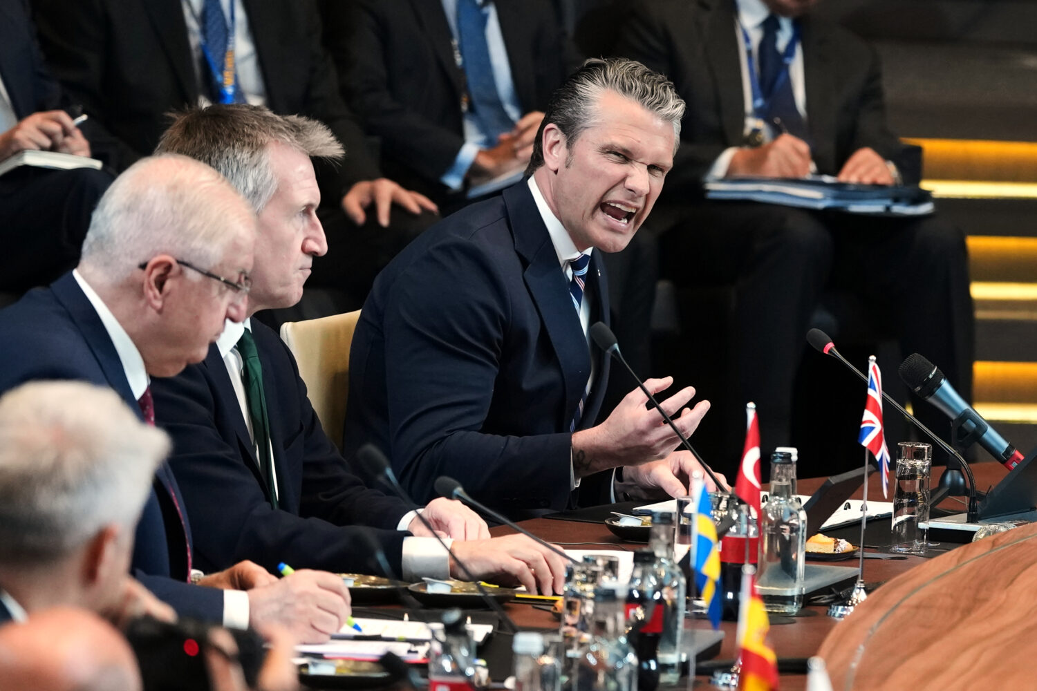 United States Defense Secretary Pete Hegseth, right, speaks during a meeting of the North Atlantic ...