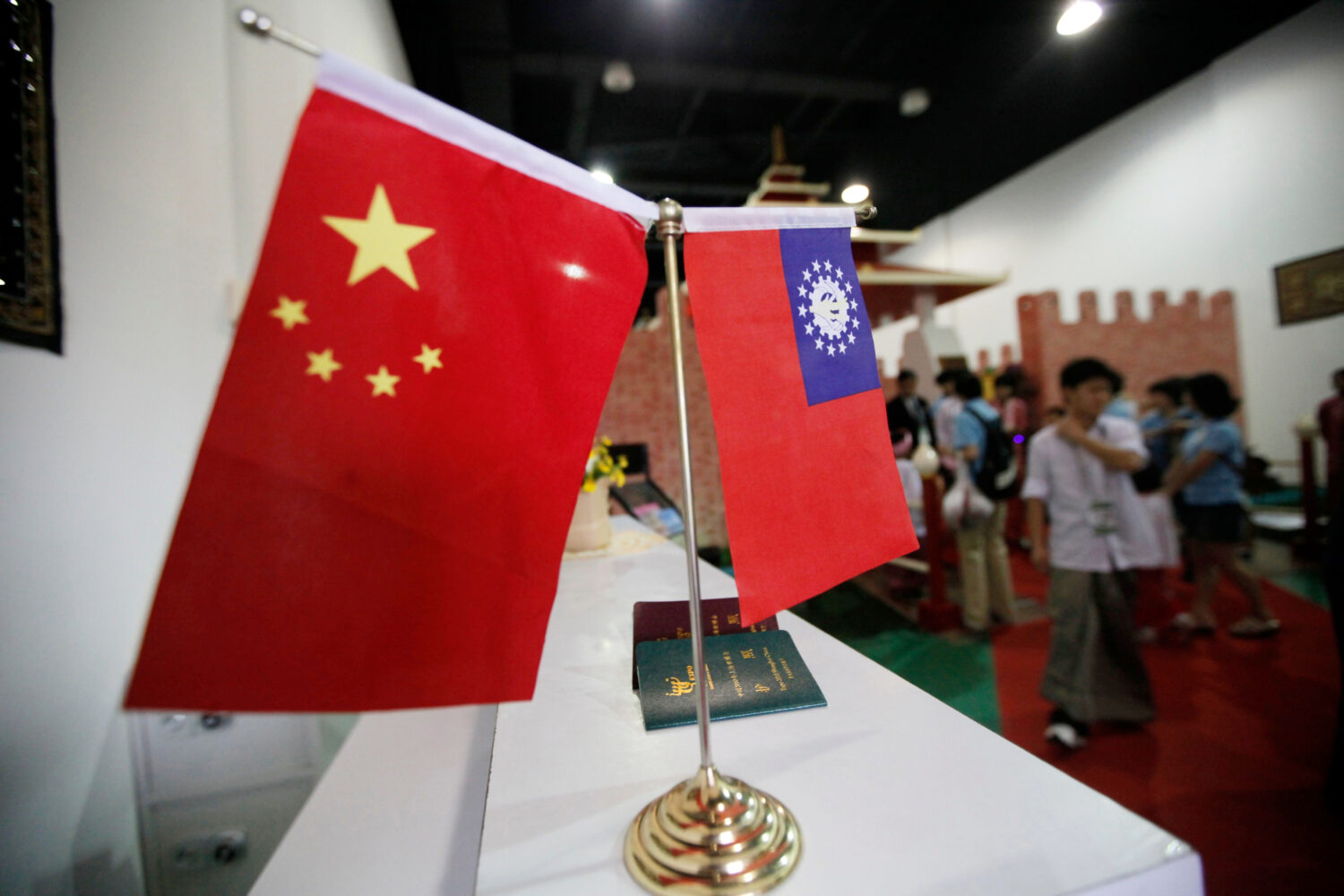 FILE - Flags of China and Myanmar are displayed at the entrance of Myanmar Pavilion prior to Myanma...