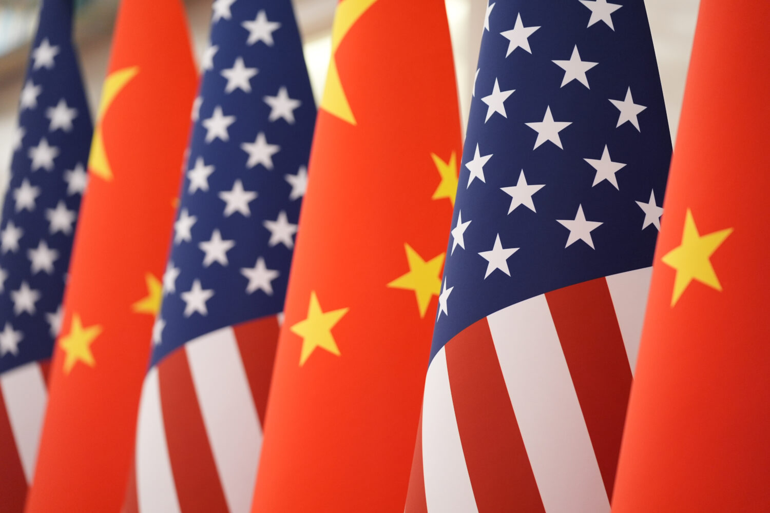 FILE - The U.S. and Chinese flag at the Great Hall of the People prior to the state dinner of Presi...