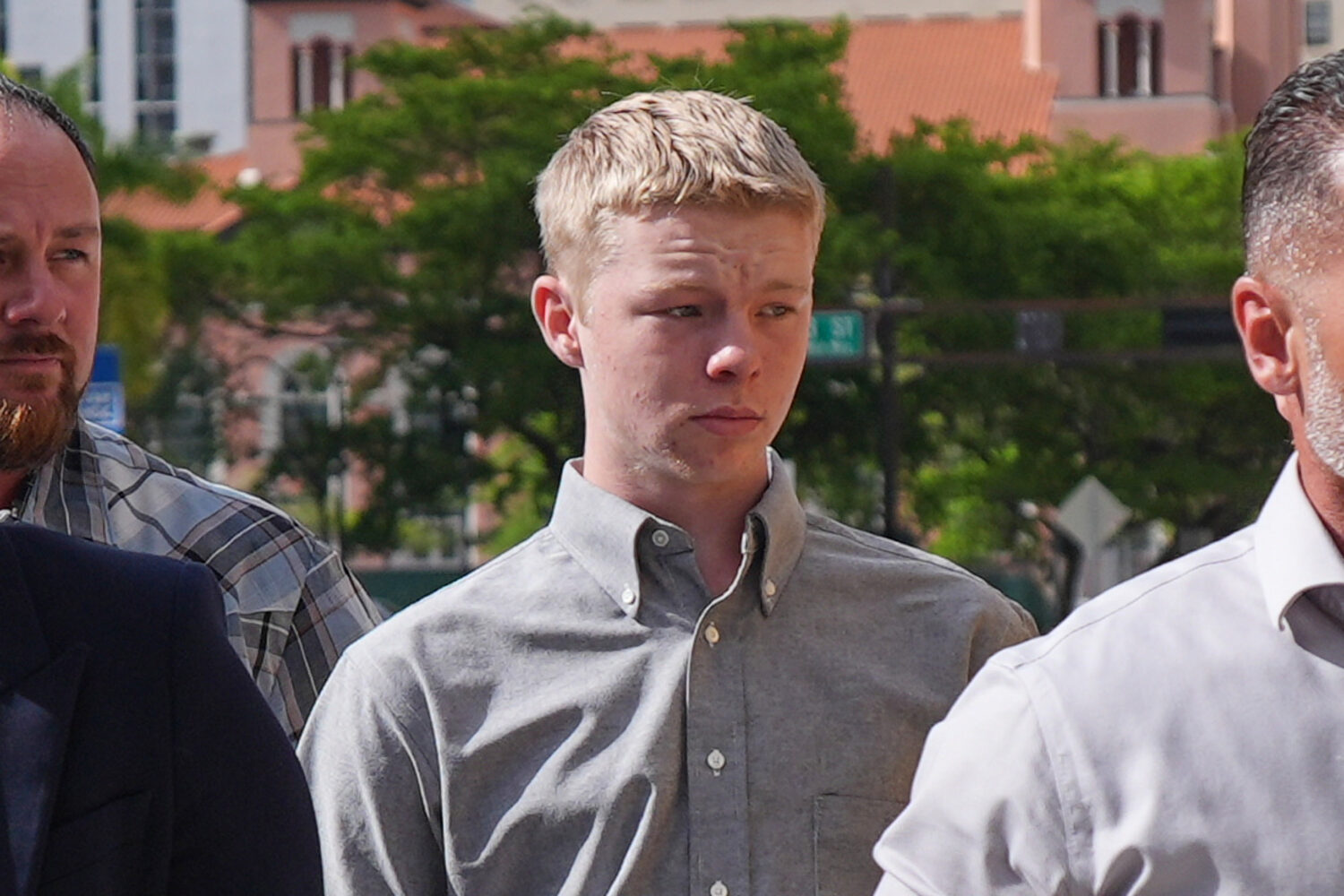 Timothy Hudson, center, charged with sexually assaulting and killing his 18-year-old stepsister on ...
