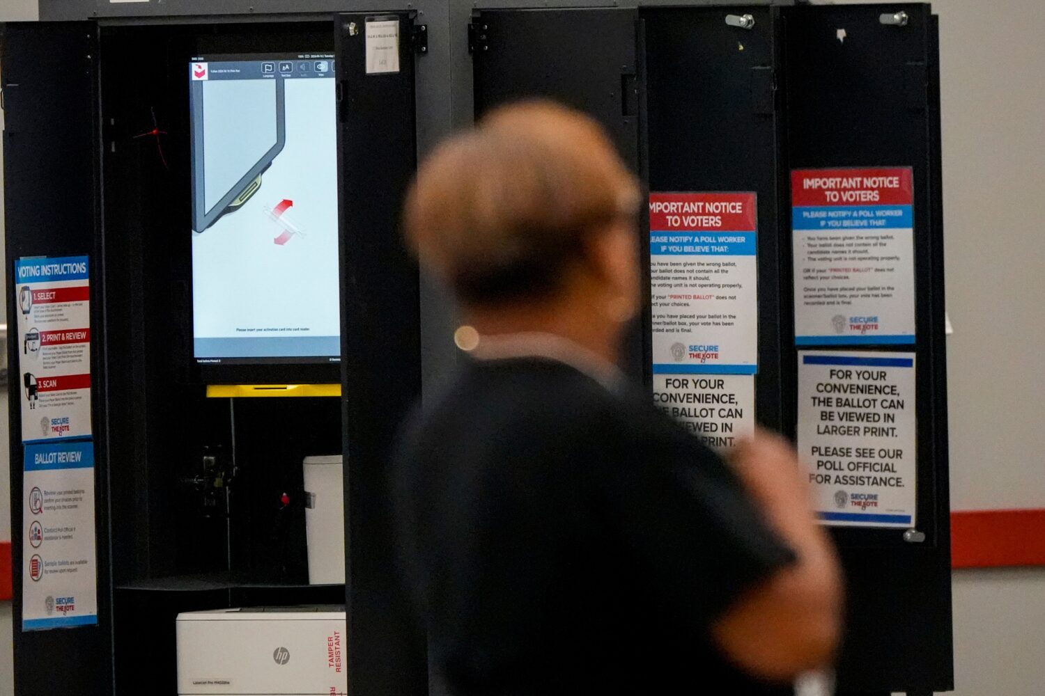 A voting machine is seen as people vote in a runoff election at the C.T. Martin Recreation Center, ...