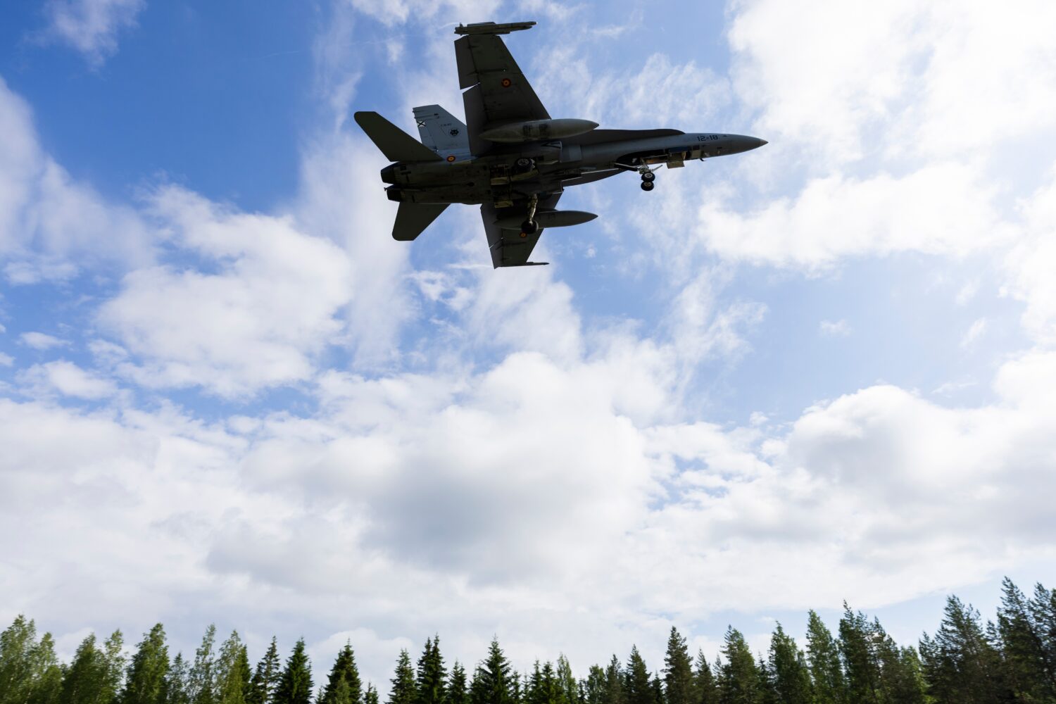 A F/A-18 Hornet multi-role fighter of the Finnish Air Force lands on a road strip during NATO's Ram...
