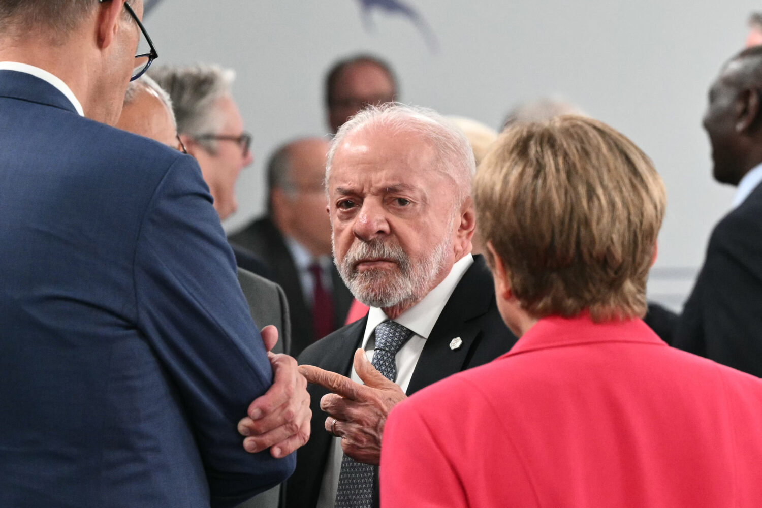 Brazil's President Luiz Inacio Lula da Silva, center, gestures as he speaks with Germany's Chancell...