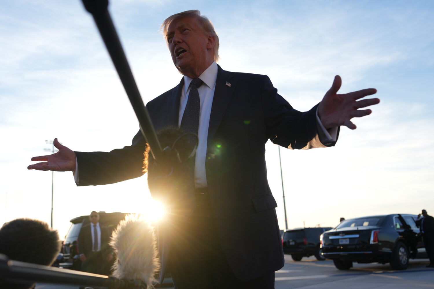 U.S. President Donald Trumptalkas to the media after disembarking Air Force One at Paris Orly Airpo...