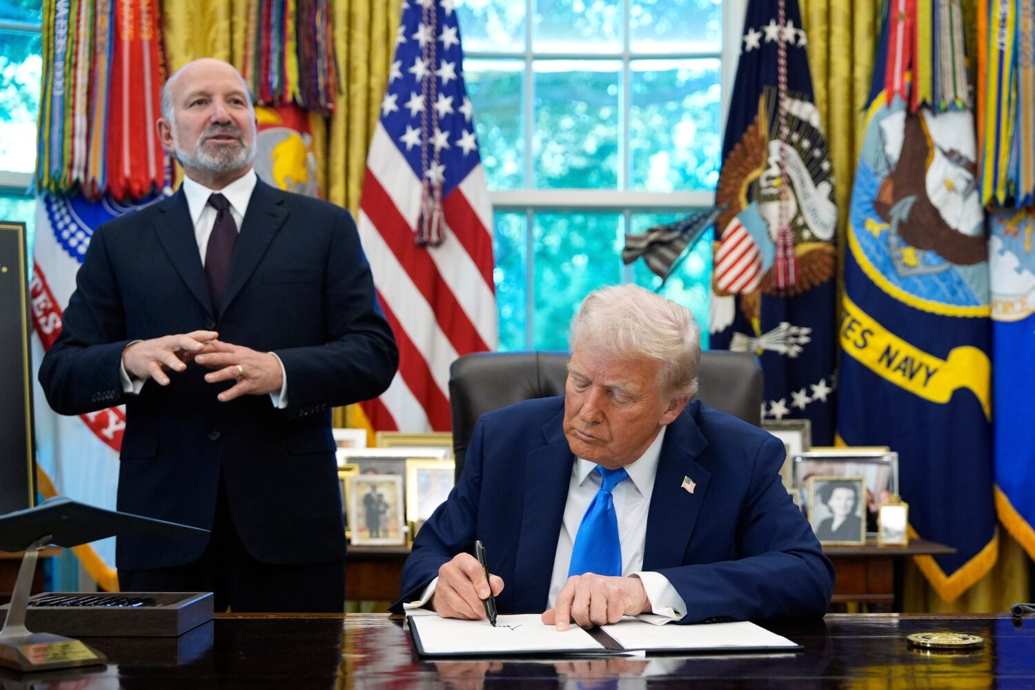 FILE - Commerce Secretary Howard Lutnick speaks as President Donald Trump signs the Gold Card execu...