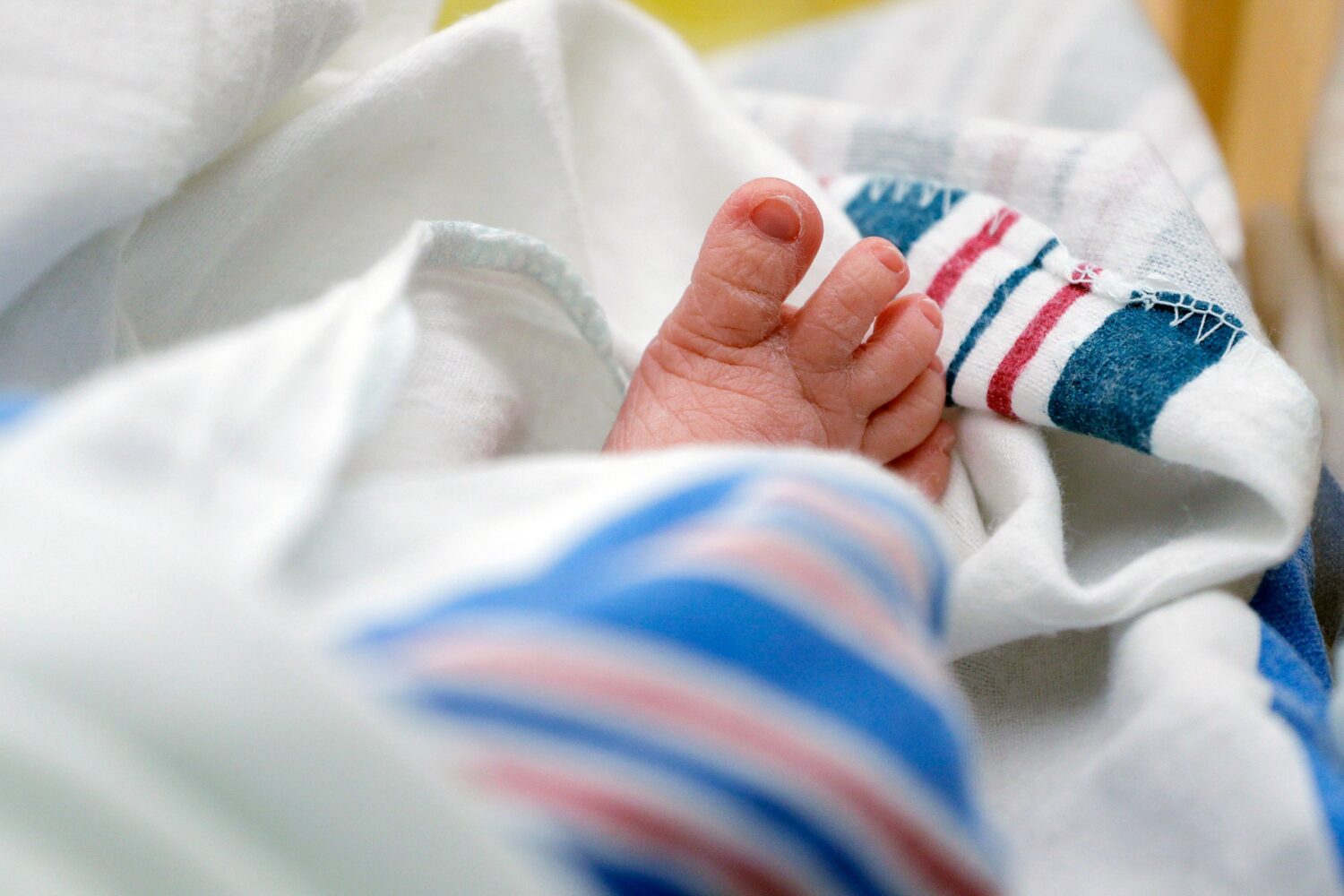 FILE - The toes of a baby peek out of a blanket at a hospital in McAllen, Texas, July, 29, 2020. (A...