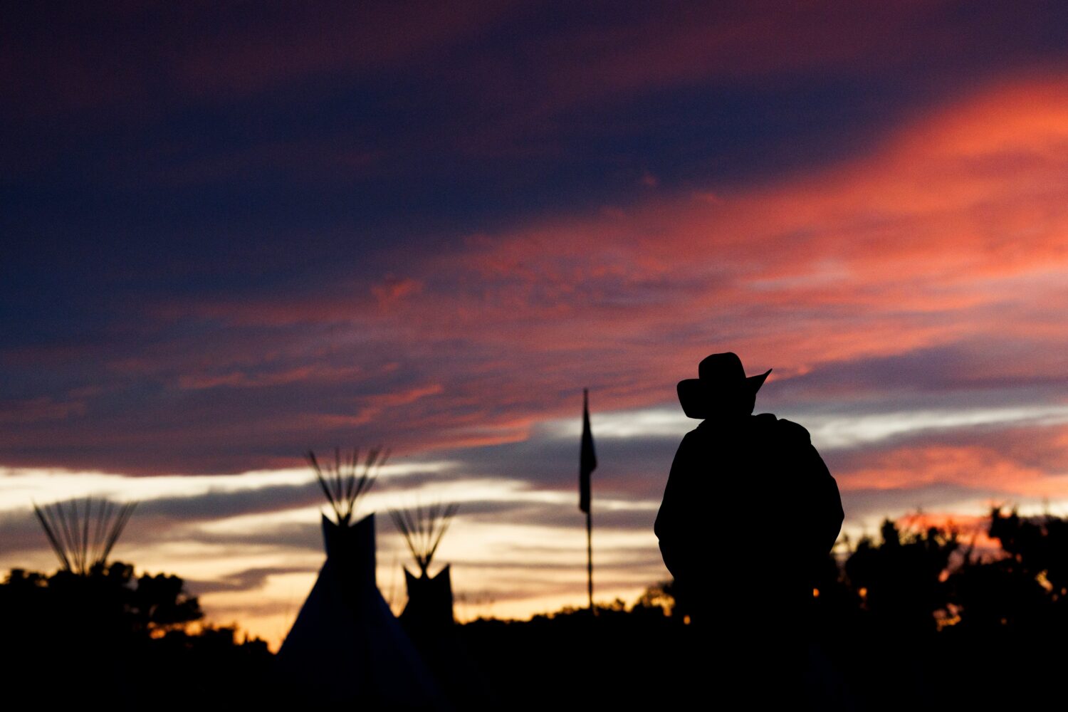 A man walks back to camp during festivities commemorating the 150th anniversary of the Battle of th...
