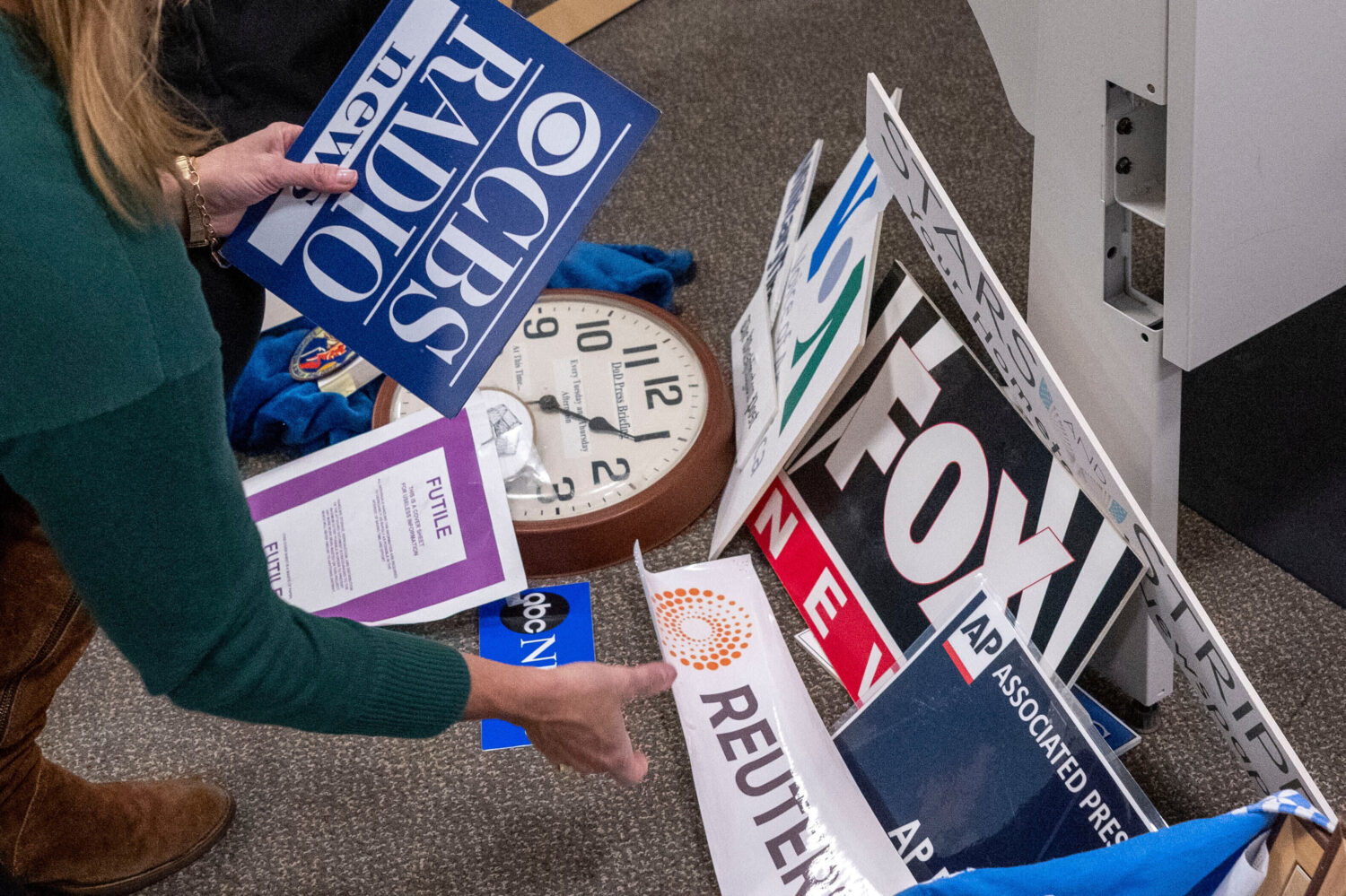 FILE - Washington Post reporter Tara Copp saves the name plaques from various news organizations as...