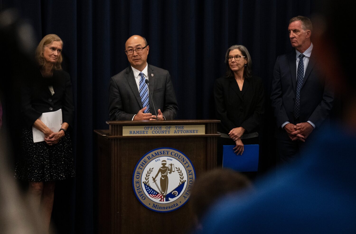 FILE - Ramsey County Attorney John Choi, at podium, discusses his office's review of former Ramsey ...