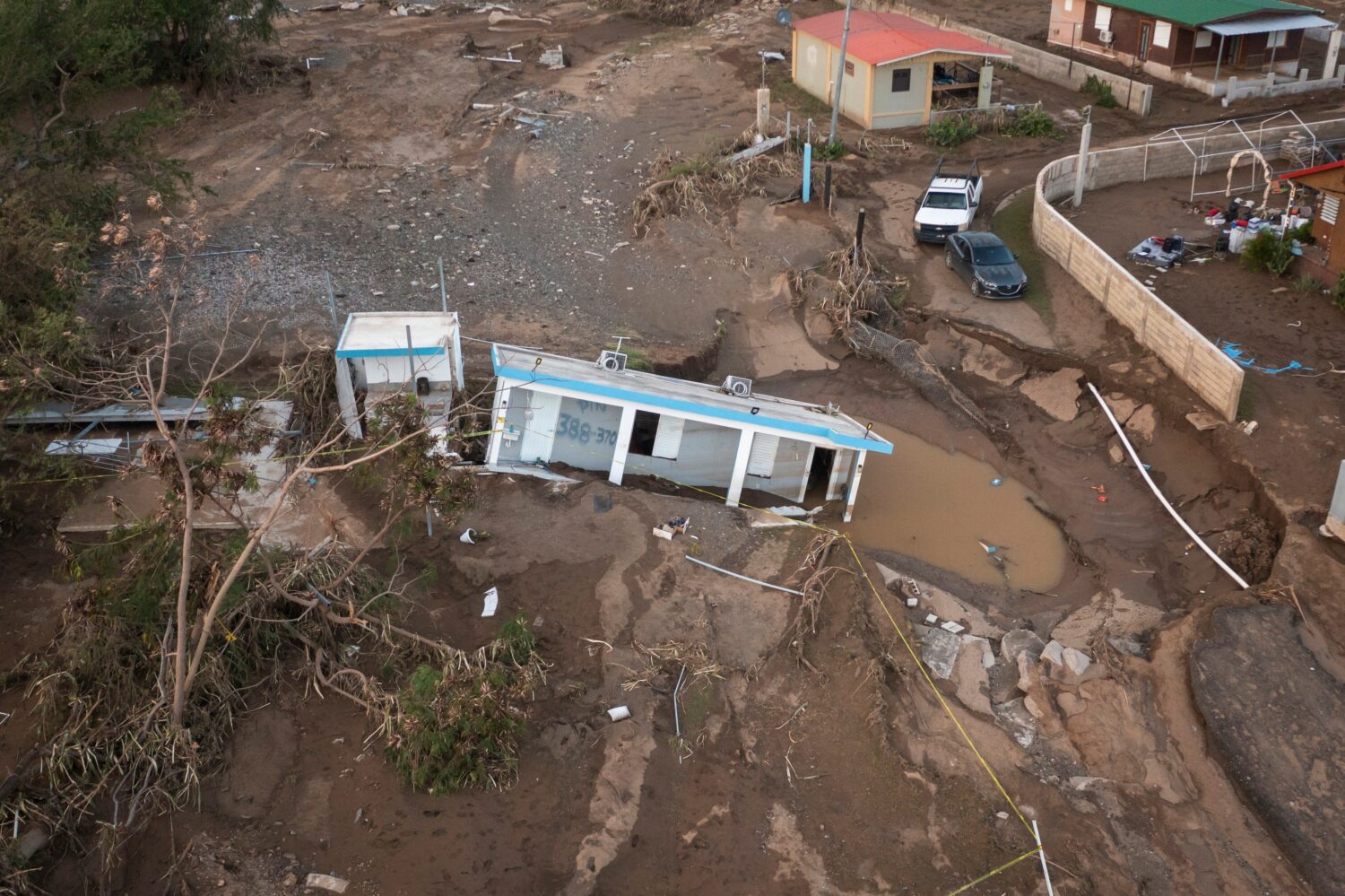 FILE - A house lays in the mud after it was washed away by Hurricane Fiona at Villa Esperanza in Sa...
