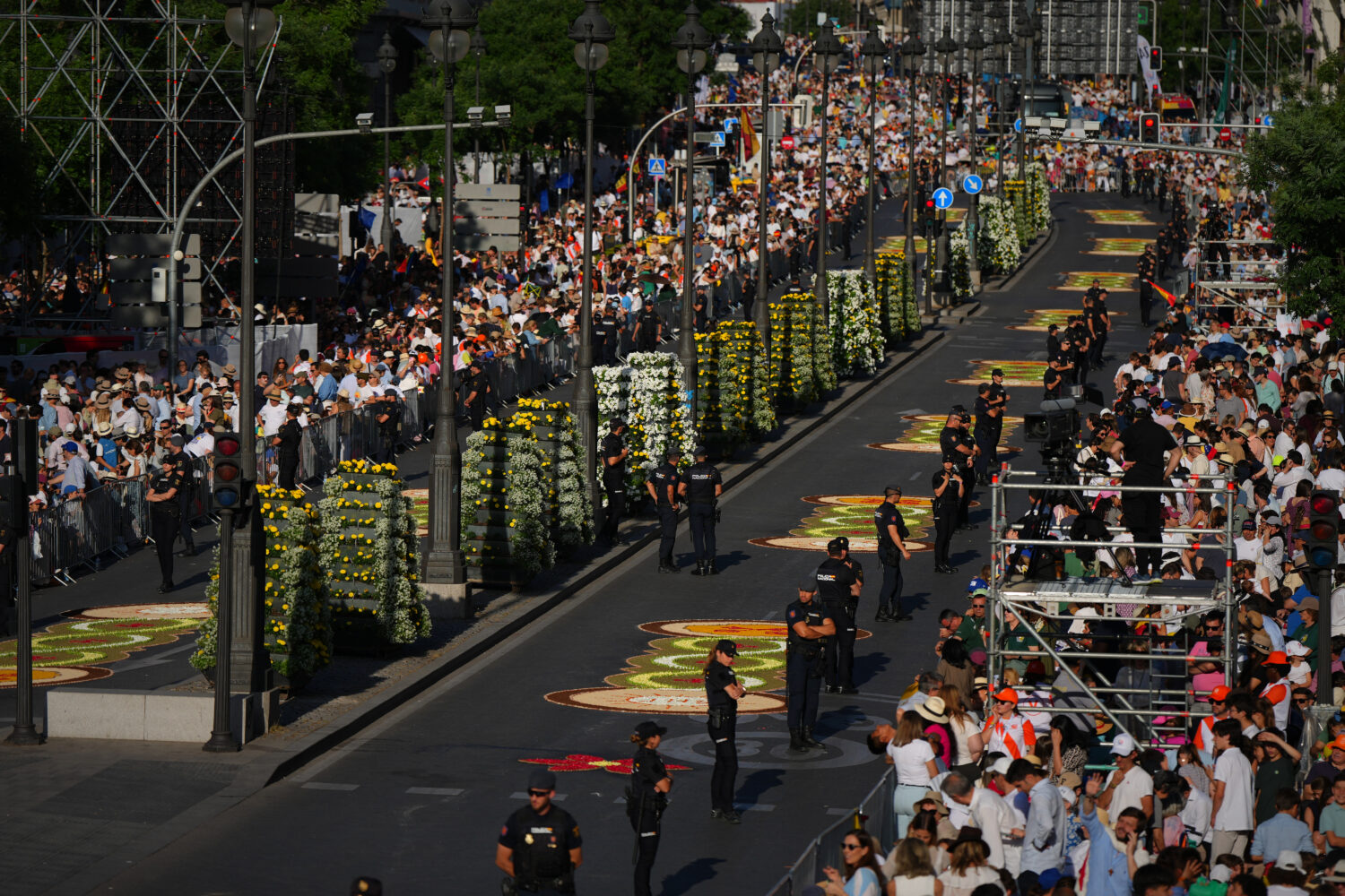 People wait for the arrival of Pope Leo XIV ahead of a Holy Mass and Corpus Christi procession at P...