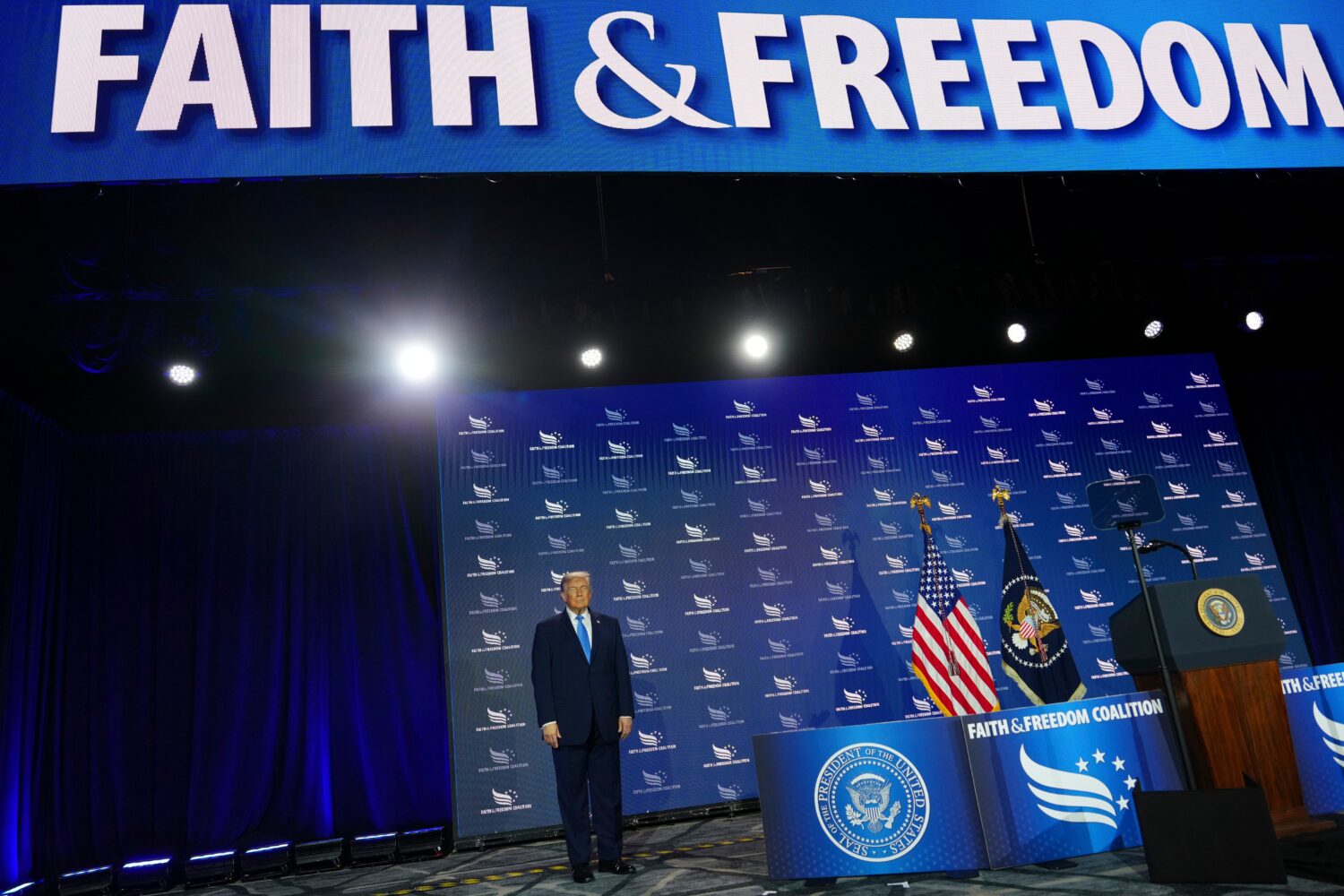 President Donald Trump arrives to speak at the Faith & Freedom Coalition's policy conference at the...